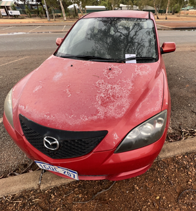 Impounded Vehicle: RED MAZDA Registration: 1GQC 207
