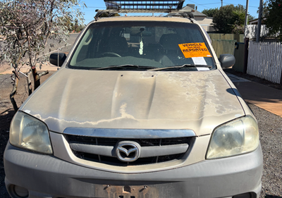 Impounded Vehicle: GREY MAZDA Registration: N/A