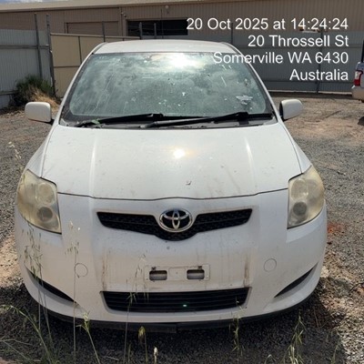 Impounded Vehicle: WHITE TOYOTA Registration: N/A