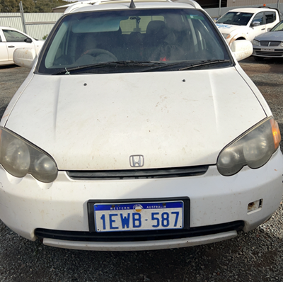 Impounded Vehicle: White HONDA Registration: 1EWB587
