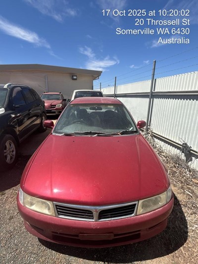 Impounded Vehicle: RED MITSUBISHI Registration: N/A