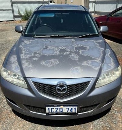 Impounded Vehicle: SILVER Mazda Registration: 1CZQ741