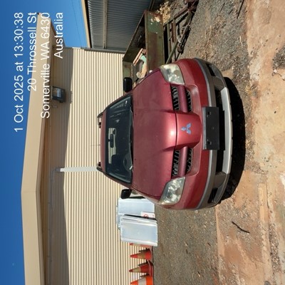 Impounded Vehicle: RED MITSUBISHI Registration: N/A
