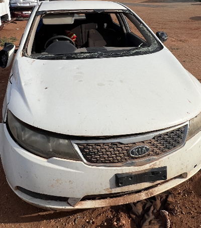 Impounded Vehicle: WHITE KIA Registration: NO