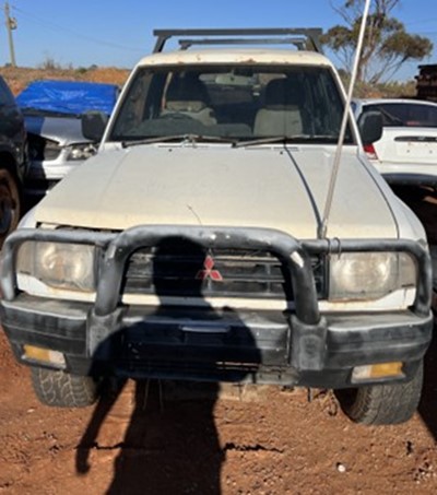 Impounded Vehicle: WHITE MITSUBISHI Registration: N/A