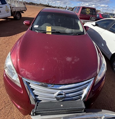 Impounded Vehicle: RED NISSAN Registration: 1ENP165