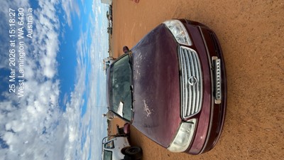 Impounded Vehicle: BURGUNDY NISSAN Registration: N/A