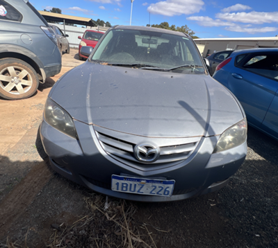 Impounded Vehicle: GREY MAZDA Registration: 1BUZ226