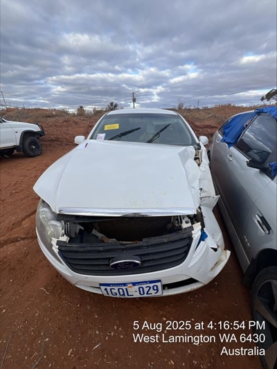Impounded Vehicle: WHITE FORD Registration: 1GQL029