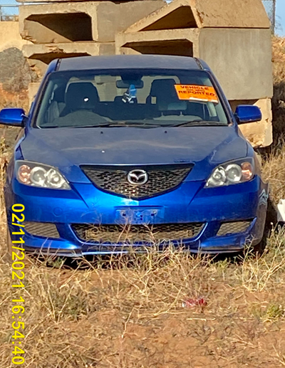 Impounded Vehicle: Blue Mazda Registration: 
