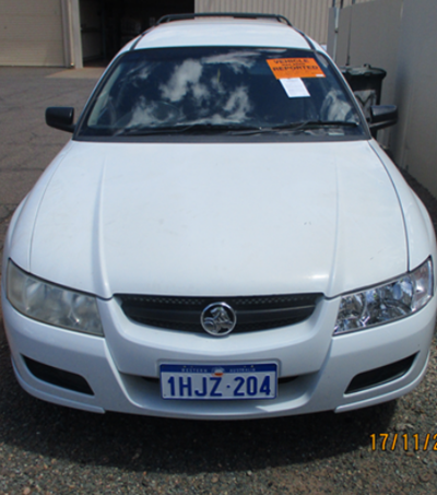 Impounded Vehicle: White Holden Registration: 1HJZ204