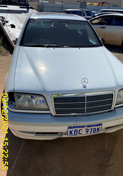 Impounded Vehicle: White Mercedes Registration: 
