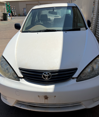 Impounded Vehicle: White Toyota Registration: N/A