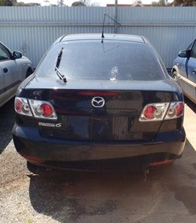 Impounded Vehicle: Black Mazda Registration: 